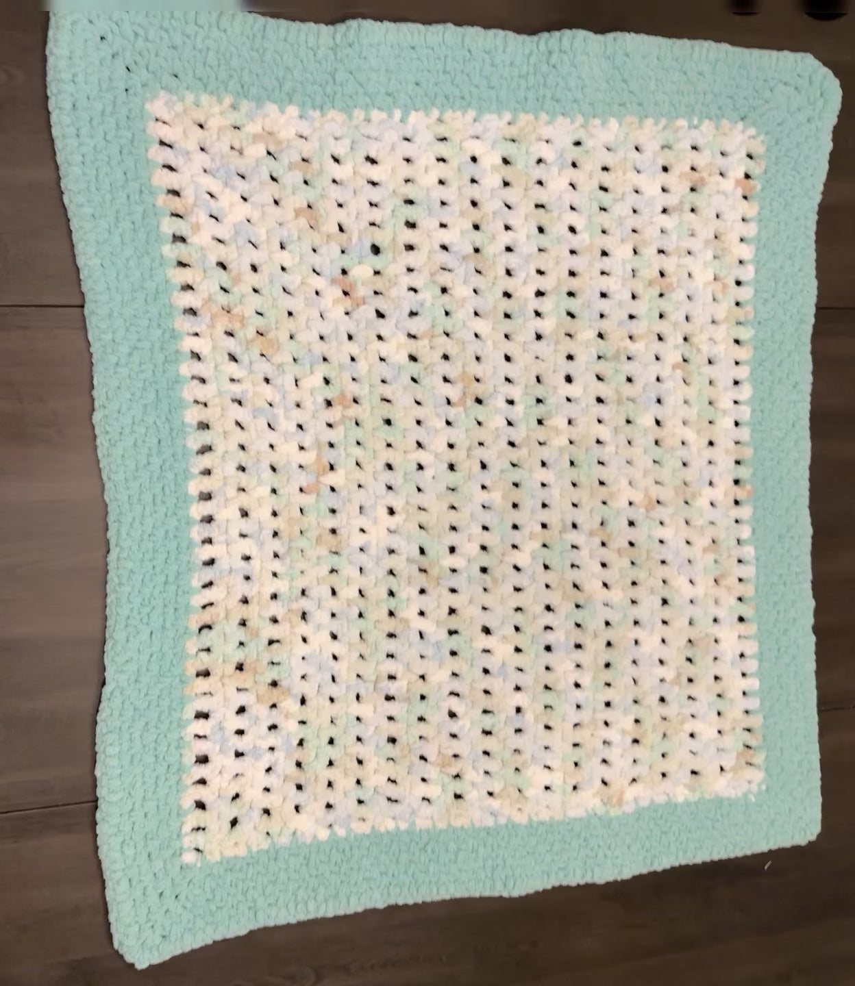 Handmade crochet blanket measuring 32" x 34"